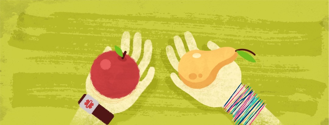 One hand holding an apple and another holding a pear. The hand holding the pear has teenager style bracelets on while the hand holding the apple has a medical bracelet