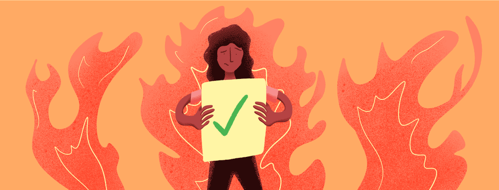 person holding positive test results, but is also on fire
