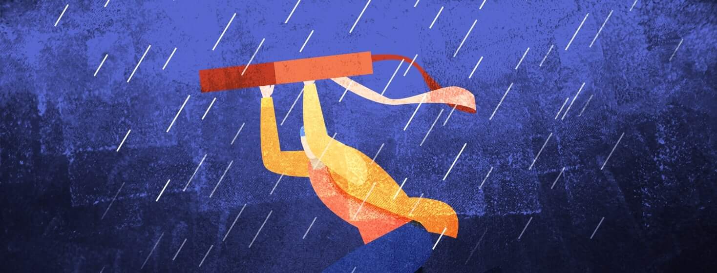 Person running through the rain holding a bag above their head