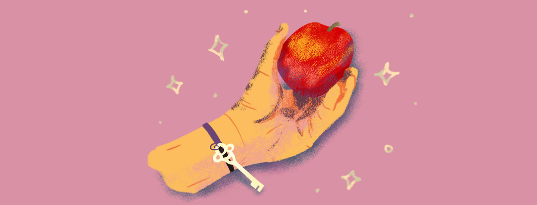 Hand holding a crisp looking apple