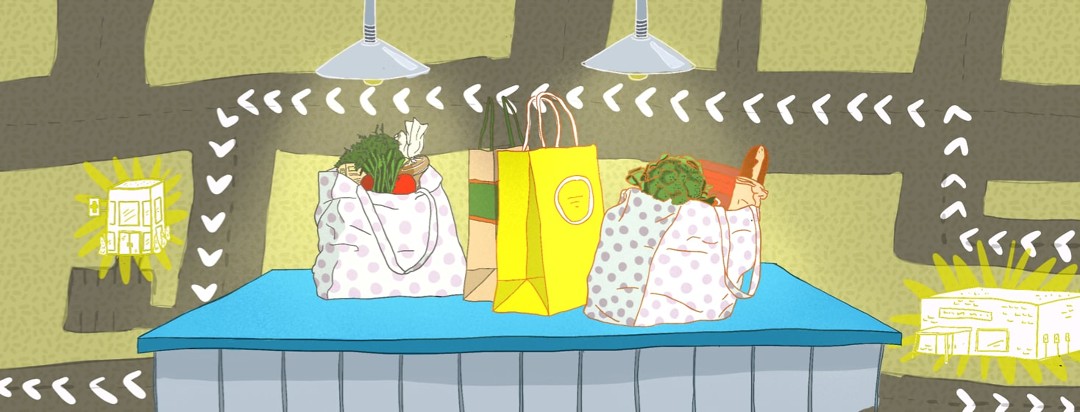 Shopping bags sitting on counter with a map in the background