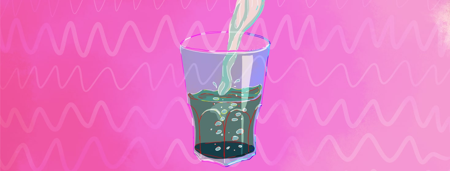 Glass half full being filled with water