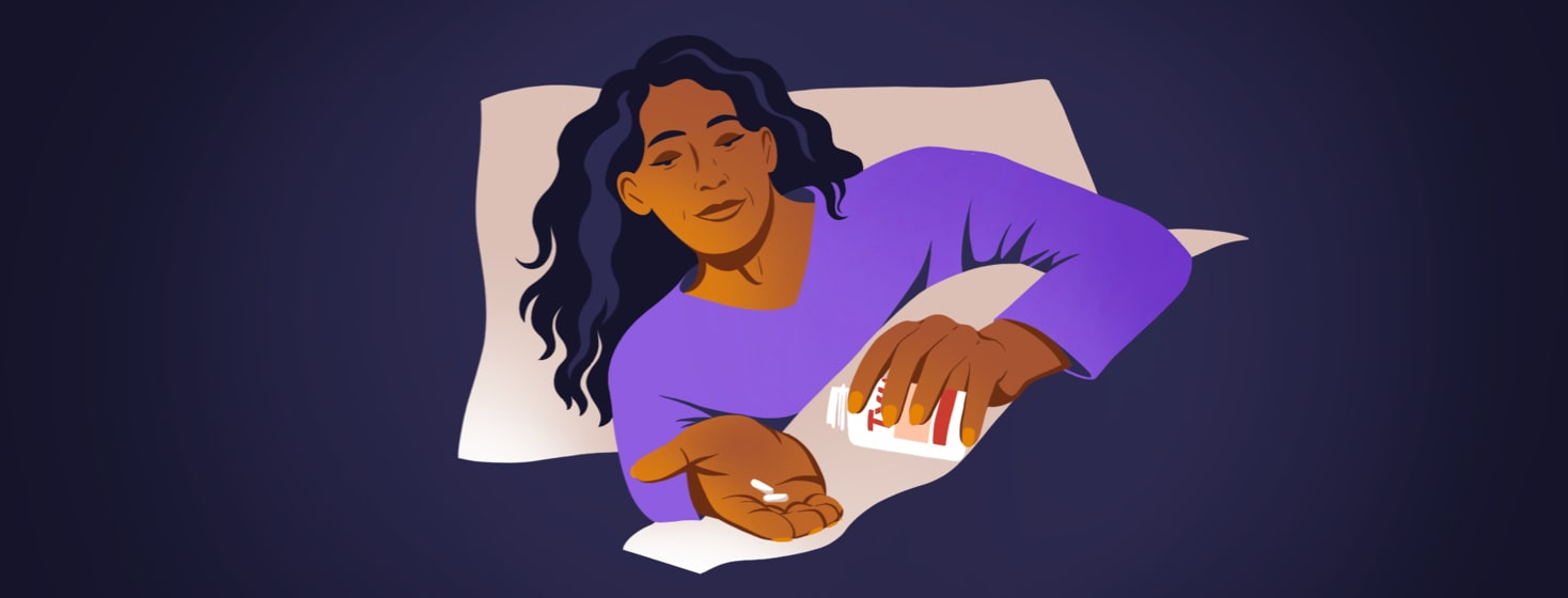 alt=a woman in bed pours two pills from a bottle into her hand