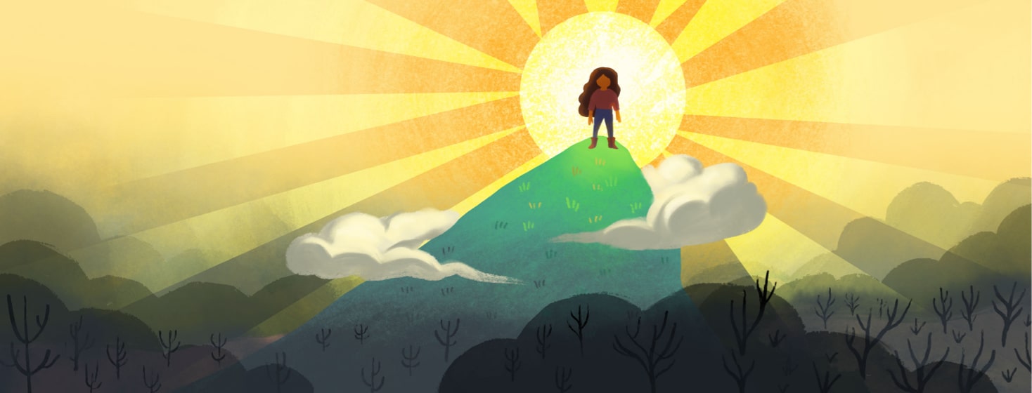 a woman standing on a hill with a bright sun behind her