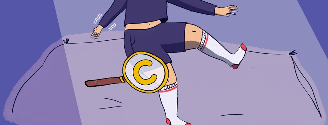 A person with their legs out on a bed with a magnifying glass showing the letter "C" over their thigh